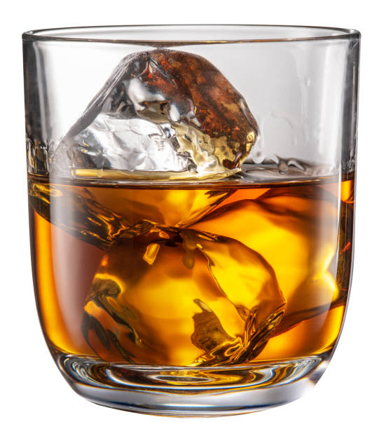 Glass of whisky with ice cubes isolated on white background. File contains clipping path. stock photo
