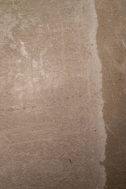 istock Grey wall is texture background. Light is reflection on wall. Can be used mock up for your product and free space for your text. Viroc wall texture 1369750754