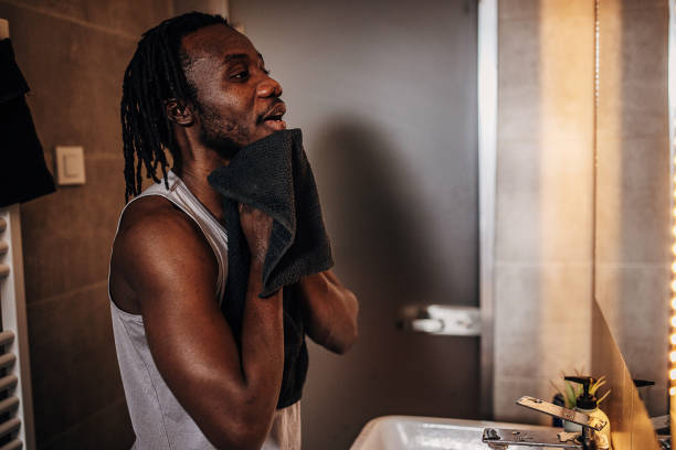 istock Man washed his face in bathroom 1369750901