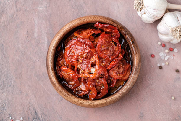 istock Sun dried red tomatoes  in  oil. 1369751181