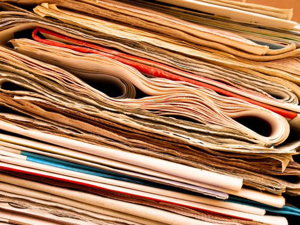 Two piles of old magazines close-up. Background.