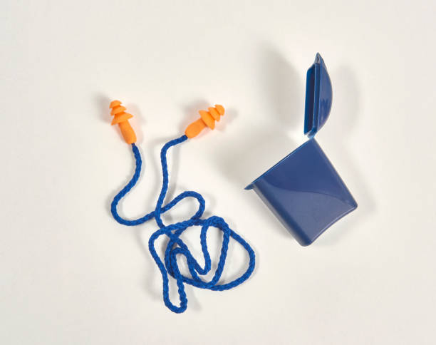 istock Earplug and box isolated on the white background, blue and orange product. 1369754225