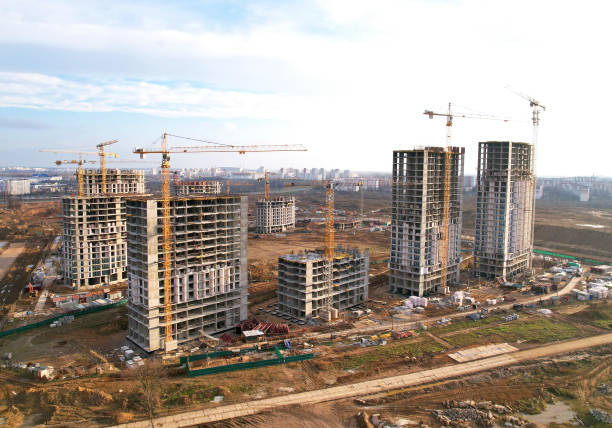 istock Construction site with tower cranes during conctruct the high-rise building. Cranes at the pouring concrete into the formwork. 1369754291