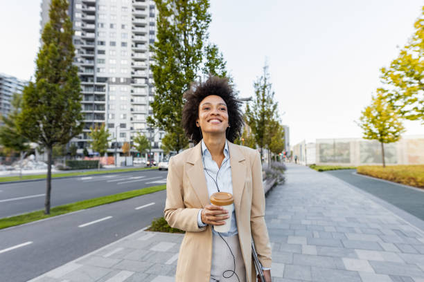 istock Well dressed woman  walking on the street after work 1369756861