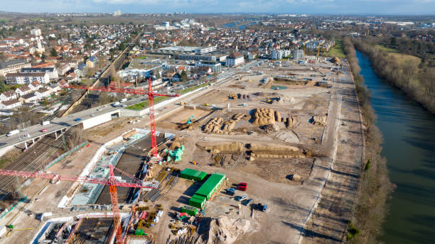 istock Large construction site, equipment - aerial view 1369757494