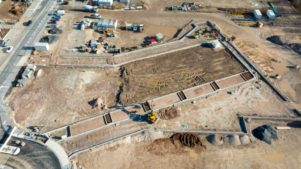 istock Large construction site, equipment - aerial view 1369757501
