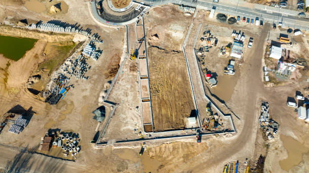 istock Large construction site, equipment - aerial view 1369757538