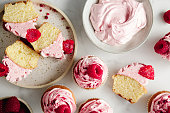 Close-up of sliced raspberry cupcakes served on the table