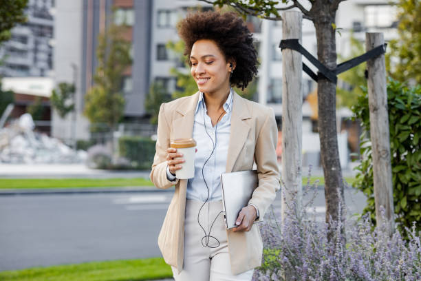 istock Well dressed woman  walking on the street after work 1369759209