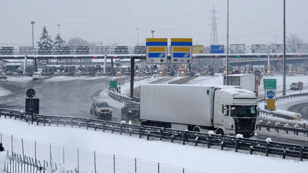 istock Snowy highway with heavy traffic 1369760649