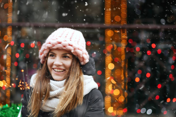 istock Awesome lady playing with sparklers during the snowfall 1369762759