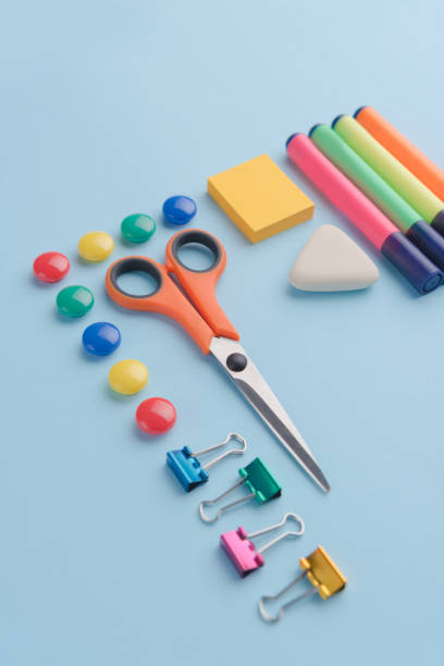 istock Office supplies on the blue background table 1369763079