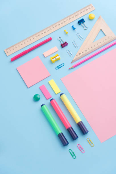 istock Office supplies on the blue background table 1369764162