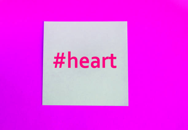 istock Hashtag Heart Word on white background and pink paper, flat lay 1369764680