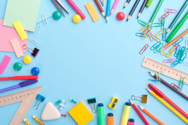 istock Office supplies on the blue background table 1369764751