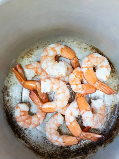 Photo of Boiled shrimp in a pot cooking preparation top view mobile photo
