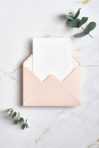 istock Envelope with greeting card mockup and eucalyptus plant on stone table. RSVP, wedding invitation card deisgn 1369770134