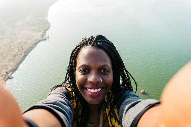 istock Woman making selfie from viewpoint at Yamuna river 1369772248