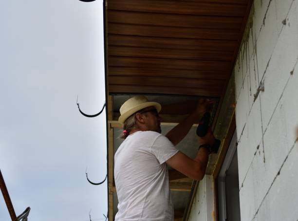 istock A carpenter mounts the roof ceiling on a scaffolding at height 1369773812