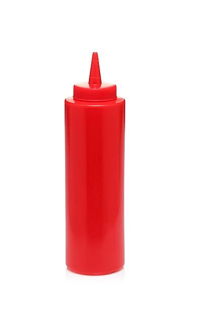 istock Red squeezey tomato ketchup bottle on white background 136977551