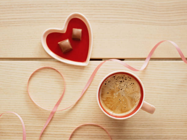 istock Love coffee cup and chocolate for Valentines day still life flat lay overhead 1369776812