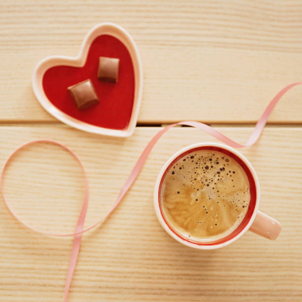 Love coffee cup and chocolate for Valentines day still lifePhoto taken indoors in studio light, flat lay overhead
