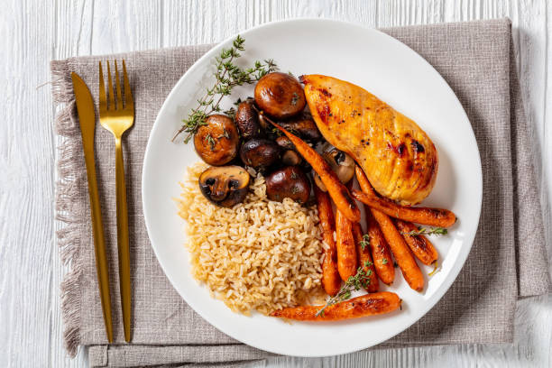 istock Chicken with rice, mushrooms and carrots 1369777809
