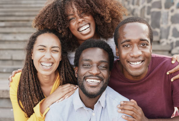 istock Young black friends smiling on camera - African diverse people concept 1369779798