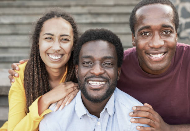 istock Young black friends smiling on camera - African diverse people concept 1369779801