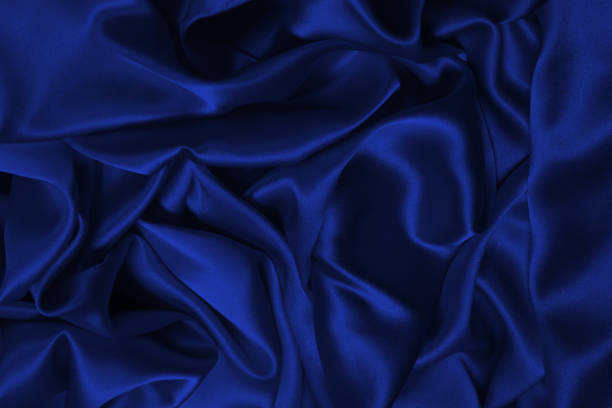 istock Rich and luxury red silk fabric texture background. 1369780600