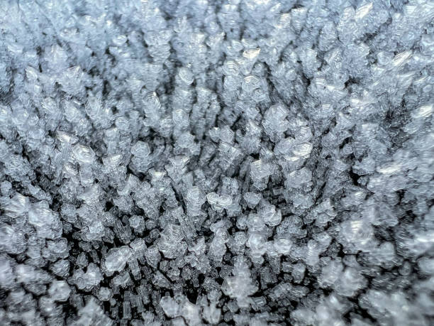 Ice crystals after a cold night on a car roof.
