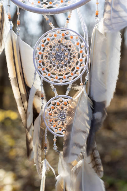 istock Handmade dream catcher with feathers threads and beads rope hanging 1369781668