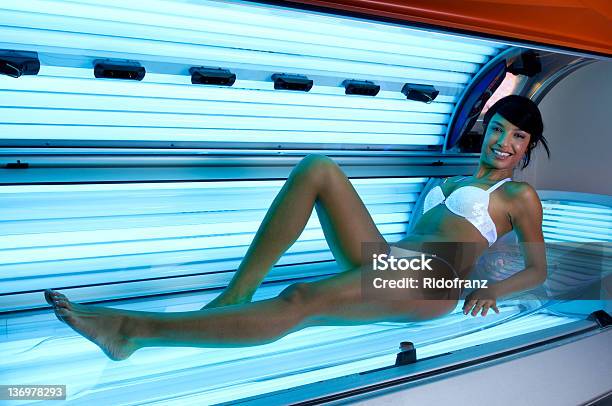 Tanning At Solarium Stock Photo - Download Image Now - Tanning Bed, Women, 20-29 Years