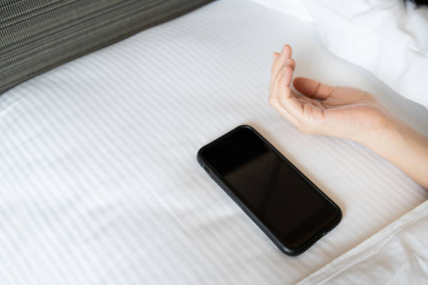 istock Woman left a mobile or smartphone on the bed. 1369783289