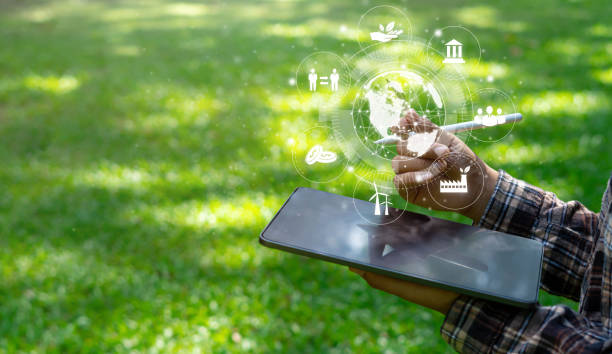 istock Surveyors at ipad communication tool ESG concept ready to study renewable resources to reduce pollution in concept ESG icon in hand for environmental, social and sustainability business governance. 1369784125