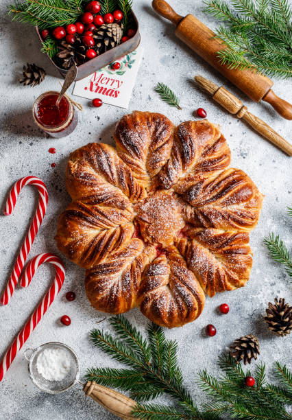 istock Christmas star bread with cranberry jam on grey Christmas background 1369784598
