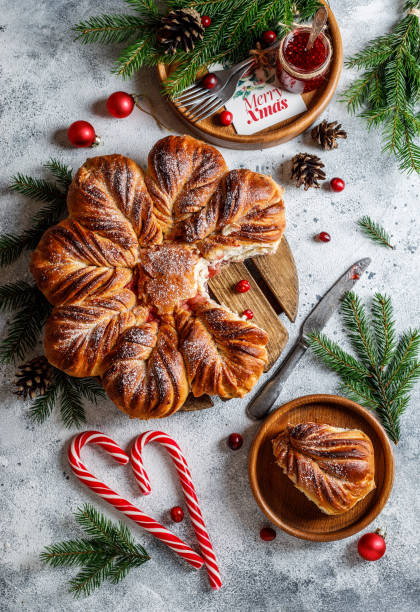 istock Christmas star bread with cranberry jam on grey Christmas background 1369784627
