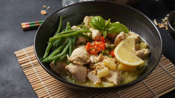 istock Thai food chicken green curry  with coconut 1369784687