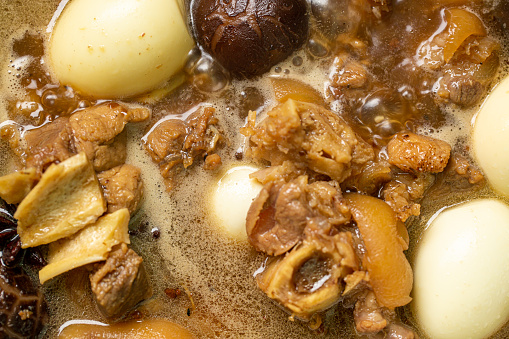Stewed Eggs,Traditional Jewish Cholent (Hamin) prepared is Israel as the main dish for the Shabbat meal made with beef, potato, beans, barley, and more and served with horseradish sauce (Chrein)