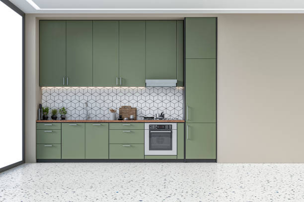Modern kitchen - 70's retro style Empty modern kitchen with khaki green high wooden kitchen cabinets with tiled pattern background and ceiling led lights. A large beige plaster wall background on terrazzo floor with copy space and windows on a side. Retro style of 70's. 3D rendered image. early 20th century kitchen stock pictures, royalty-free photos & images