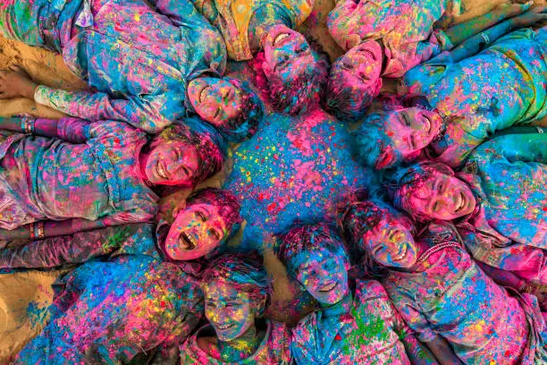 Photo of Group of happy Indian children playing holi, desert village, India