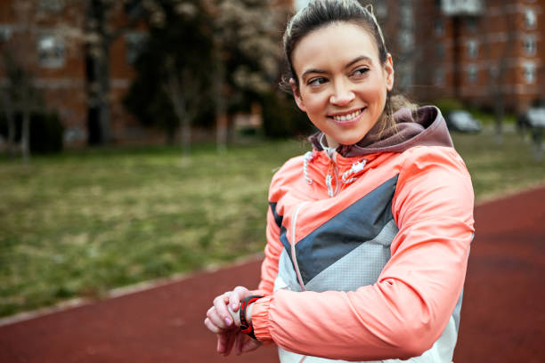 istock Athletic woman watching performance on her smartwatch 1369794892