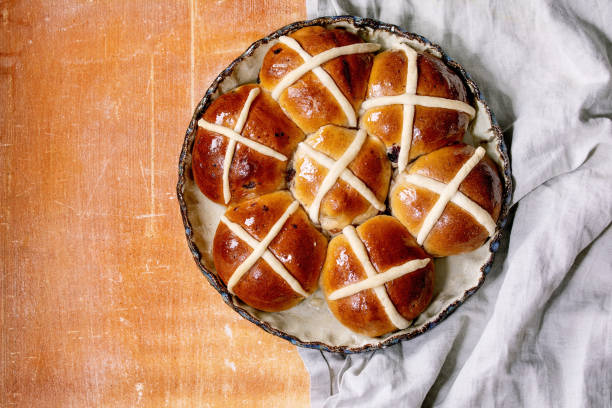 istock Homemade Easter traditional hot cross buns on ceramic dish 1369795133
