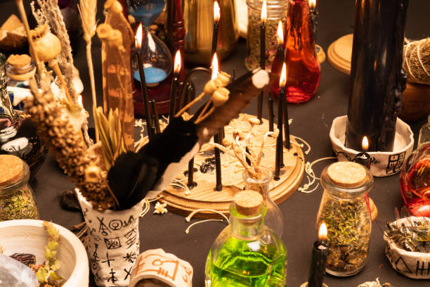 istock Witchcraft table set, selective focus. Alchemy and esoteric symbol items for magic cult. Spiritual occultism and magic chemistry inspired by mysticism. Witch and warlock magician concept. Halloween. 1369795303