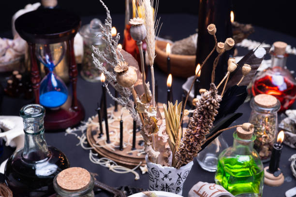 istock Witchcraft still life with witch weeds selective focus at front. Esoteric gothic and occult witch ritual for Halloween. Various magic objects and ritual arrangement with symbols. Gothic Halloween. 1369795873