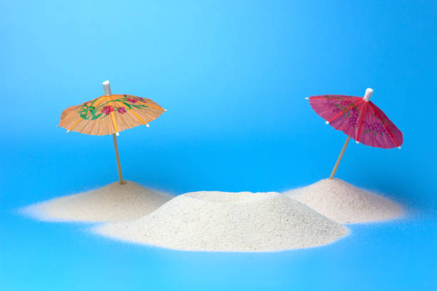 istock Beach paper umbrellas on the sand. 1369798864