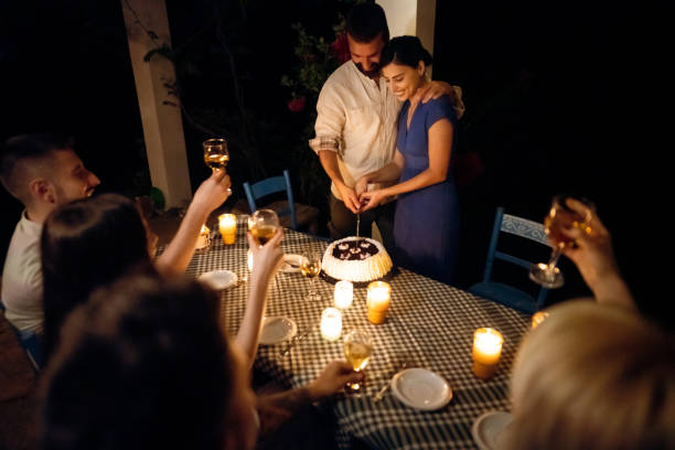 istock People toasting while celebrate their friends engagement. during garden party 1369799721