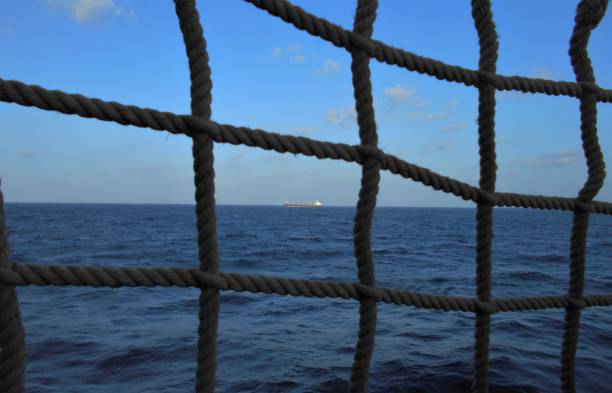 istock View through the rope guard rail of a ship 1369801075