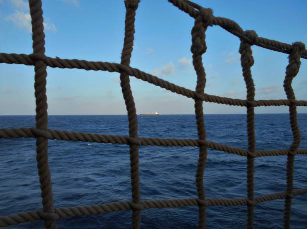 istock View through the rope guard rail of a ship 1369801110