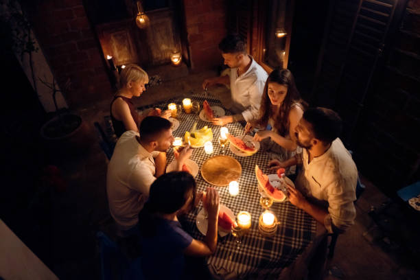 istock Carefree couples having a serene time together during dinner party 1369801165